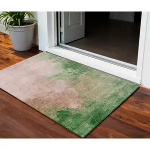 Photo of Pink And Green Abstract Washable Indoor Outdoor Area Rug