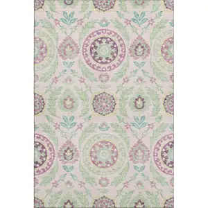 Photo of Pink And Green Floral Washable Area Rug With UV Protection