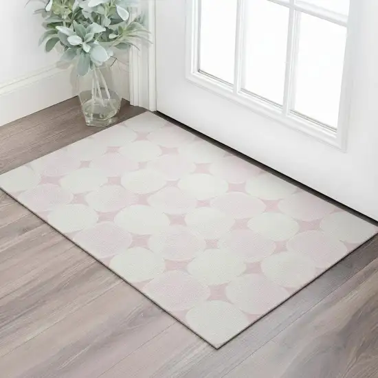 Pink And Ivory Abstract Geometric Washable Area Rug With UV Protection Photo 1