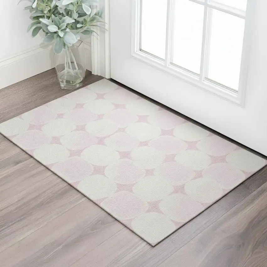 Pink And Ivory Abstract Geometric Washable Area Rug With UV Protection Photo 1