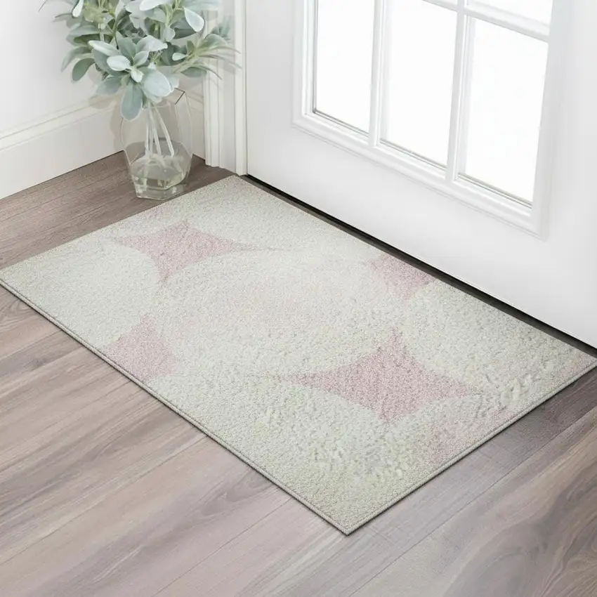 Pink And Ivory Abstract Geometric Washable Area Rug With UV Protection Photo 2