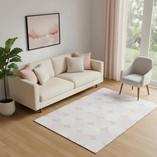 Pink And Ivory Abstract Geometric Washable Area Rug With UV Protection Photo 1