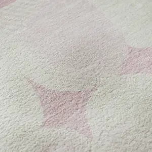 Photo of Pink And Ivory Abstract Geometric Washable Area Rug With UV Protection
