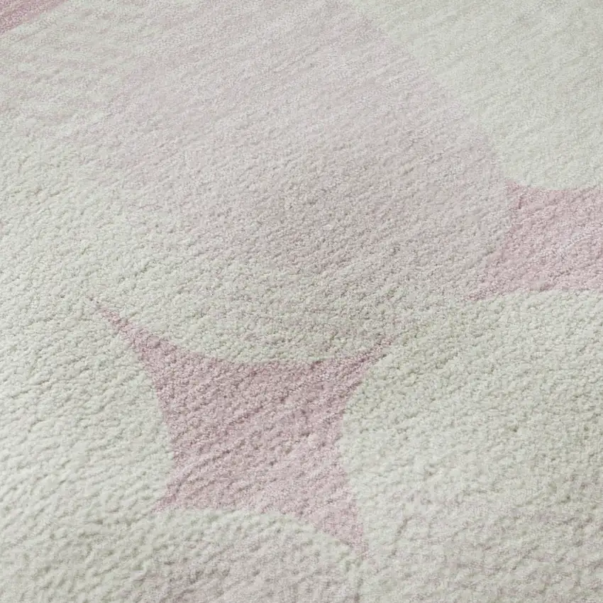 Pink And Ivory Abstract Geometric Washable Area Rug With UV Protection Photo 1