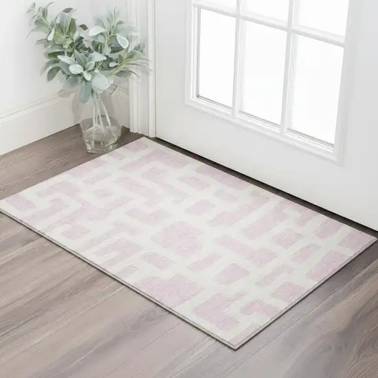 Pink And Ivory Abstract Geometric Washable Area Rug With UV Protection Photo 2