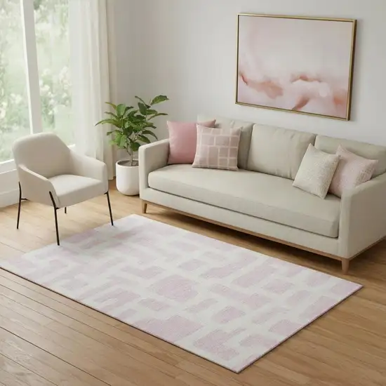 Pink And Ivory Abstract Geometric Washable Area Rug With UV Protection Photo 1