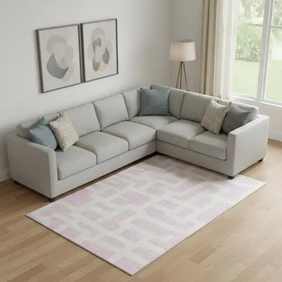 Pink And Ivory Abstract Geometric Washable Area Rug With UV Protection Photo 1
