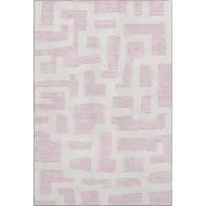 Photo of Pink And Ivory Abstract Geometric Washable Area Rug With UV Protection