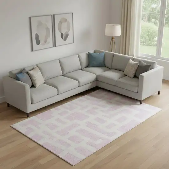 Pink And Ivory Abstract Geometric Washable Area Rug With UV Protection Photo 1