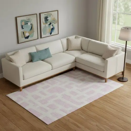 Pink And Ivory Abstract Geometric Washable Area Rug With UV Protection Photo 1