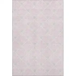 Photo of Pink And Ivory Abstract Geometric Washable Area Rug With UV Protection