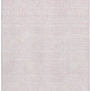 Photo of Pink And Ivory Abstract Geometric Washable Area Rug With UV Protection
