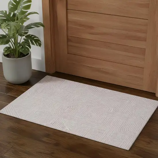 Pink And Ivory Abstract Geometric Washable Area Rug With UV Protection Photo 1