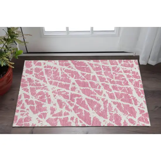 Pink And Ivory Abstract Washable Area Rug With UV Protection Photo 2