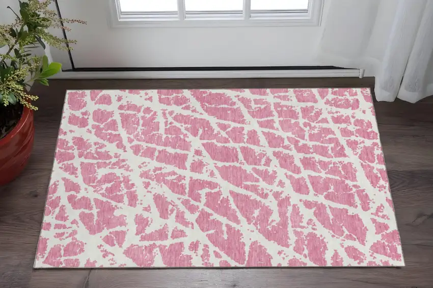 Pink And Ivory Abstract Washable Area Rug With UV Protection Photo 2