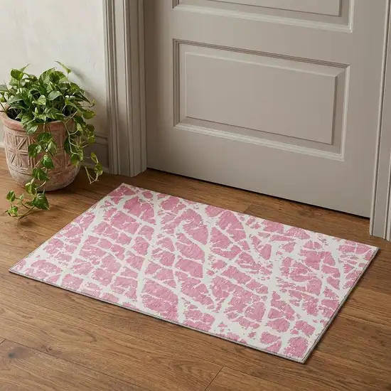 Pink And Ivory Abstract Washable Area Rug With UV Protection Photo 1