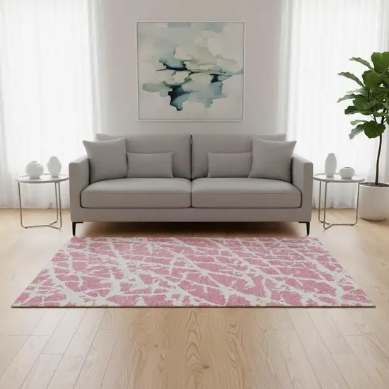 Pink And Ivory Abstract Washable Area Rug With UV Protection Photo 1