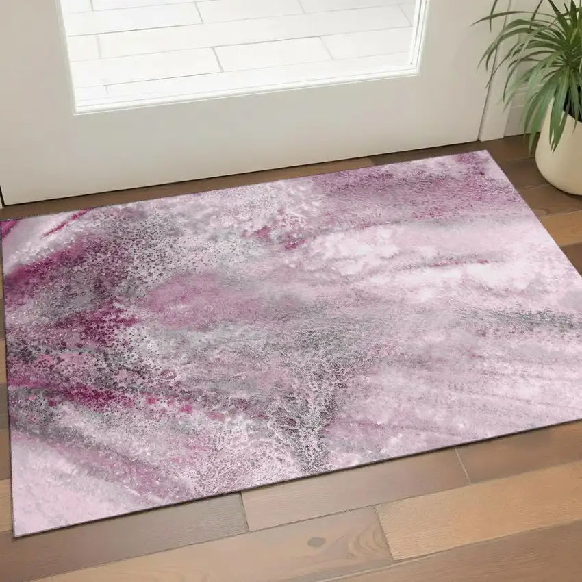 Pink And Ivory Abstract Washable Area Rug With UV Protection Photo 1