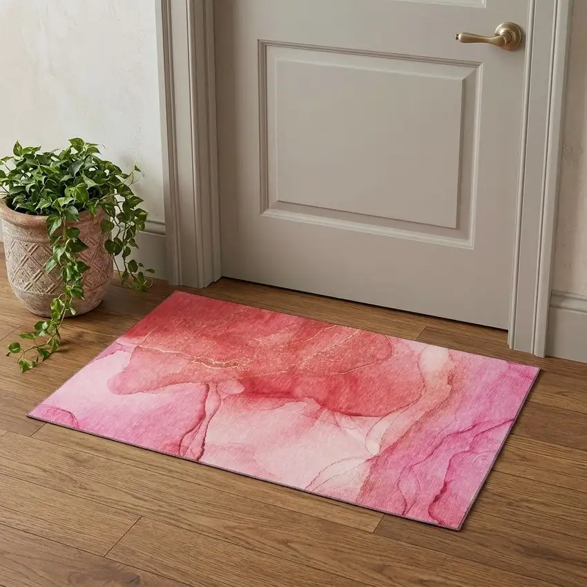 Pink And Ivory Abstract Washable Area Rug With UV Protection Photo 1