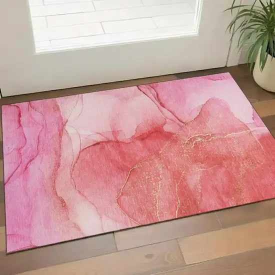 Pink And Ivory Abstract Washable Area Rug With UV Protection Photo 1