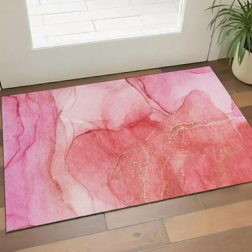 Pink And Ivory Abstract Washable Area Rug With UV Protection Photo 1
