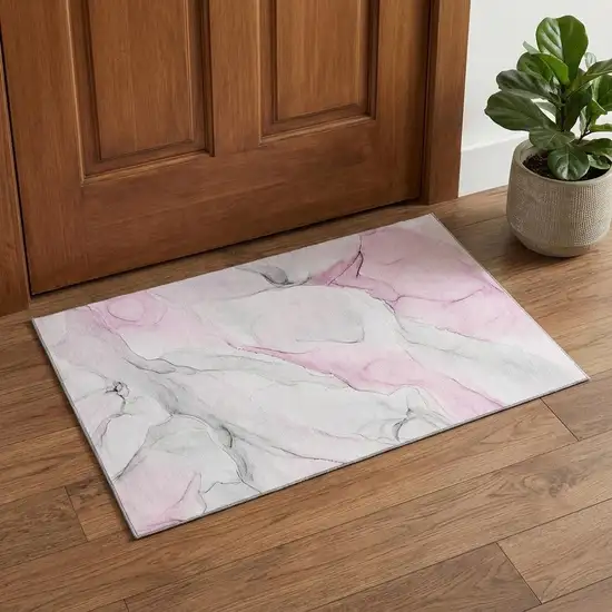 Pink And Ivory Abstract Washable Area Rug With UV Protection Photo 1