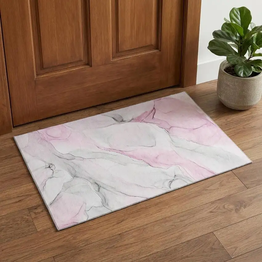 Pink And Ivory Abstract Washable Area Rug With UV Protection Photo 1