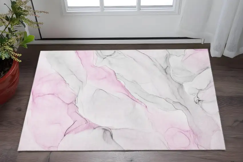 Pink And Ivory Abstract Washable Area Rug With UV Protection Photo 2