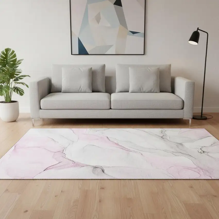Pink And Ivory Abstract Washable Area Rug With UV Protection Photo 1