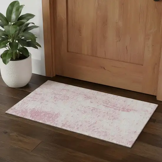 Pink And Ivory Abstract Washable Area Rug With UV Protection Photo 1