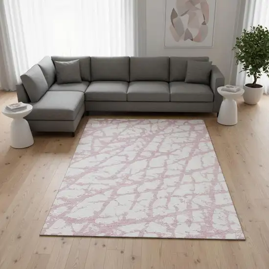 Pink And Ivory Abstract Washable Area Rug With UV Protection Photo 1