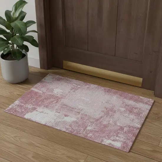 Pink And Ivory Abstract Washable Area Rug With UV Protection Photo 1