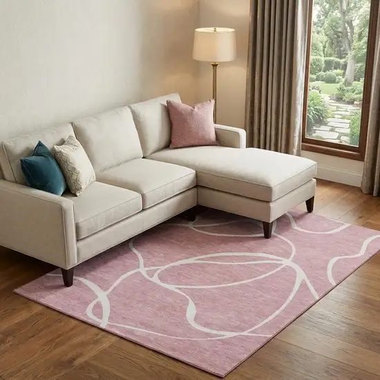 Pink And Ivory Abstract Washable Area Rug With UV Protection Photo 1