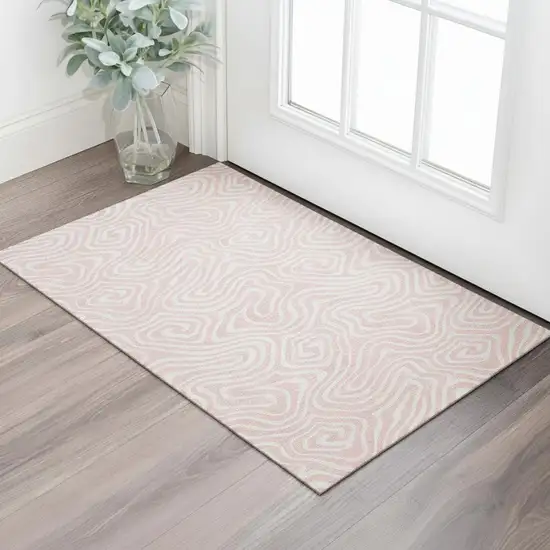 Pink And Ivory Abstract Washable Area Rug With UV Protection Photo 2
