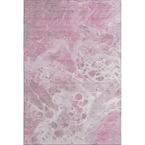 Photo of Pink And Ivory Abstract Washable Area Rug With UV Protection