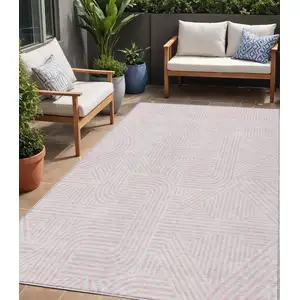 Photo of Pink And Ivory Abstract Washable Indoor Outdoor Area Rug
