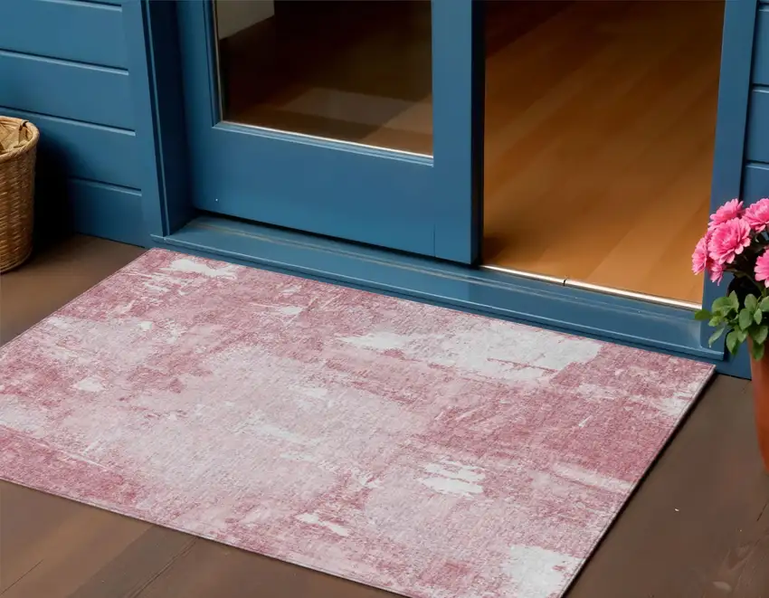Pink And Ivory Abstract Washable Indoor Outdoor Area Rug Photo 1