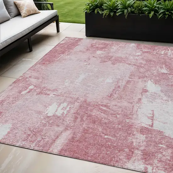 Pink And Ivory Abstract Washable Indoor Outdoor Area Rug Photo 1