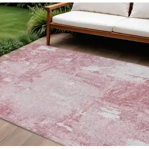Photo of Pink And Ivory Abstract Washable Indoor Outdoor Area Rug