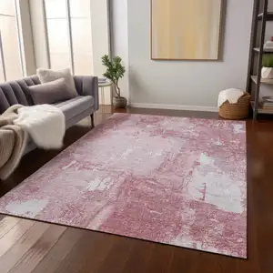 Photo of Pink And Ivory Abstract Washable Indoor Outdoor Area Rug