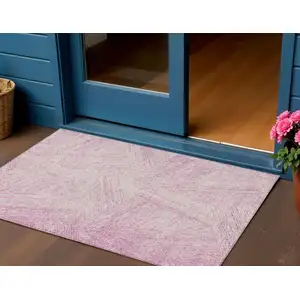 Photo of Pink And Ivory Abstract Washable Indoor Outdoor Area Rug