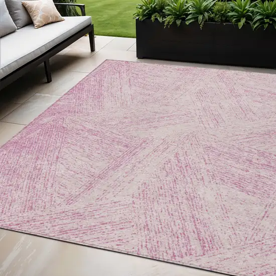 Pink And Ivory Abstract Washable Indoor Outdoor Area Rug Photo 1