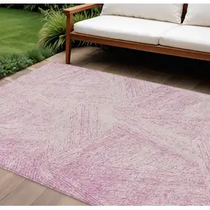 Photo of Pink And Ivory Abstract Washable Indoor Outdoor Area Rug