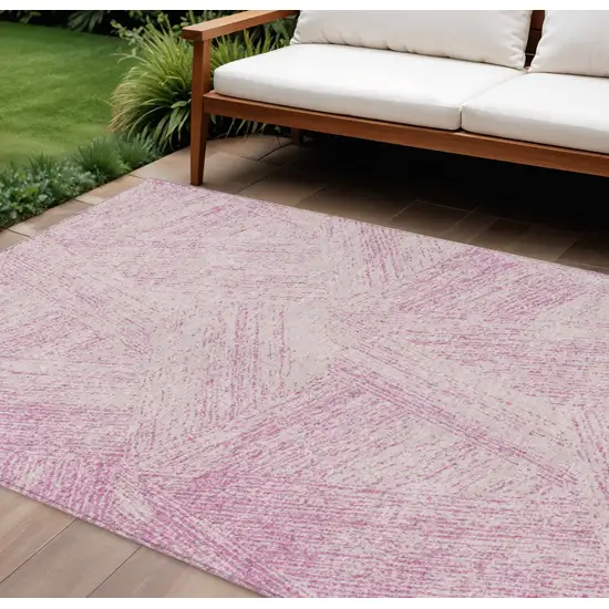 Pink And Ivory Abstract Washable Indoor Outdoor Area Rug Photo 1