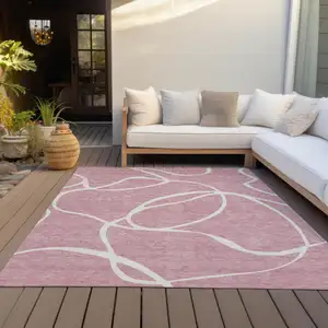 Photo of Pink And Ivory Abstract Washable Indoor Outdoor Area Rug