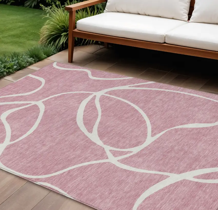 Pink And Ivory Abstract Washable Indoor Outdoor Area Rug Photo 1
