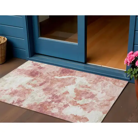 Pink And Ivory Abstract Washable Indoor Outdoor Area Rug Photo 1