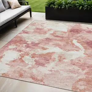 Photo of Pink And Ivory Abstract Washable Indoor Outdoor Area Rug
