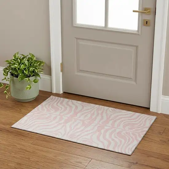 Pink And Ivory Animal Print Washable Area Rug With UV Protection Photo 1