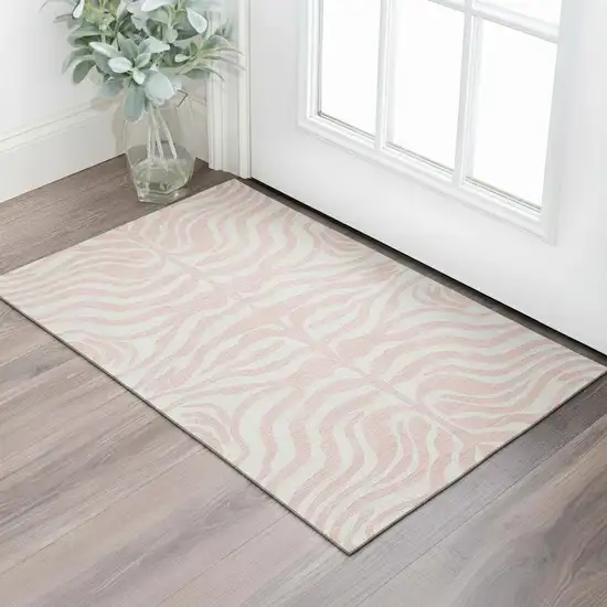 Pink And Ivory Animal Print Washable Area Rug With UV Protection Photo 2